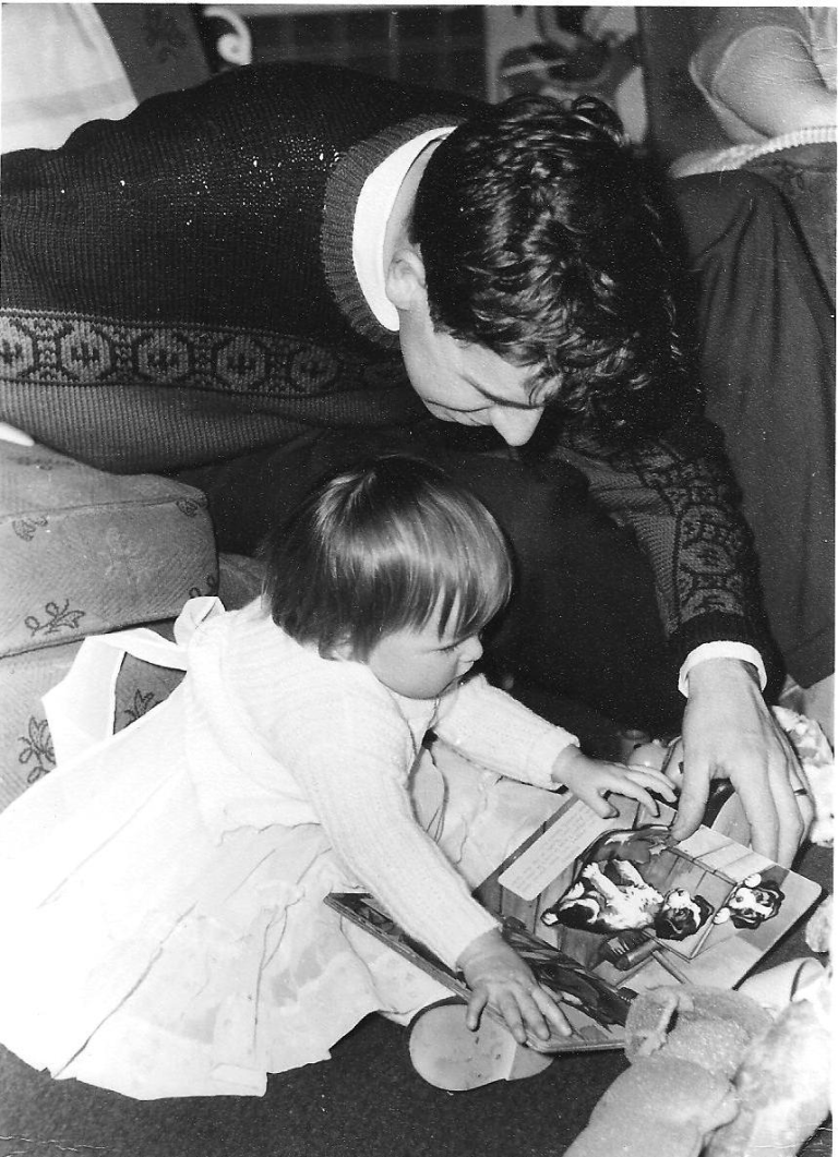 Me, aged four, reading with my dad, John